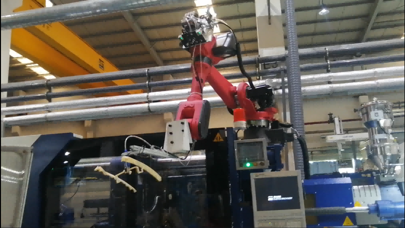 Robot work with injection machine Robot work with injection machine